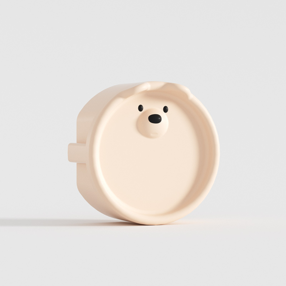 Cache prise bebe tête d’ours beige en silicone, design mignon et sécuritaire pour chambre d’enfant.
