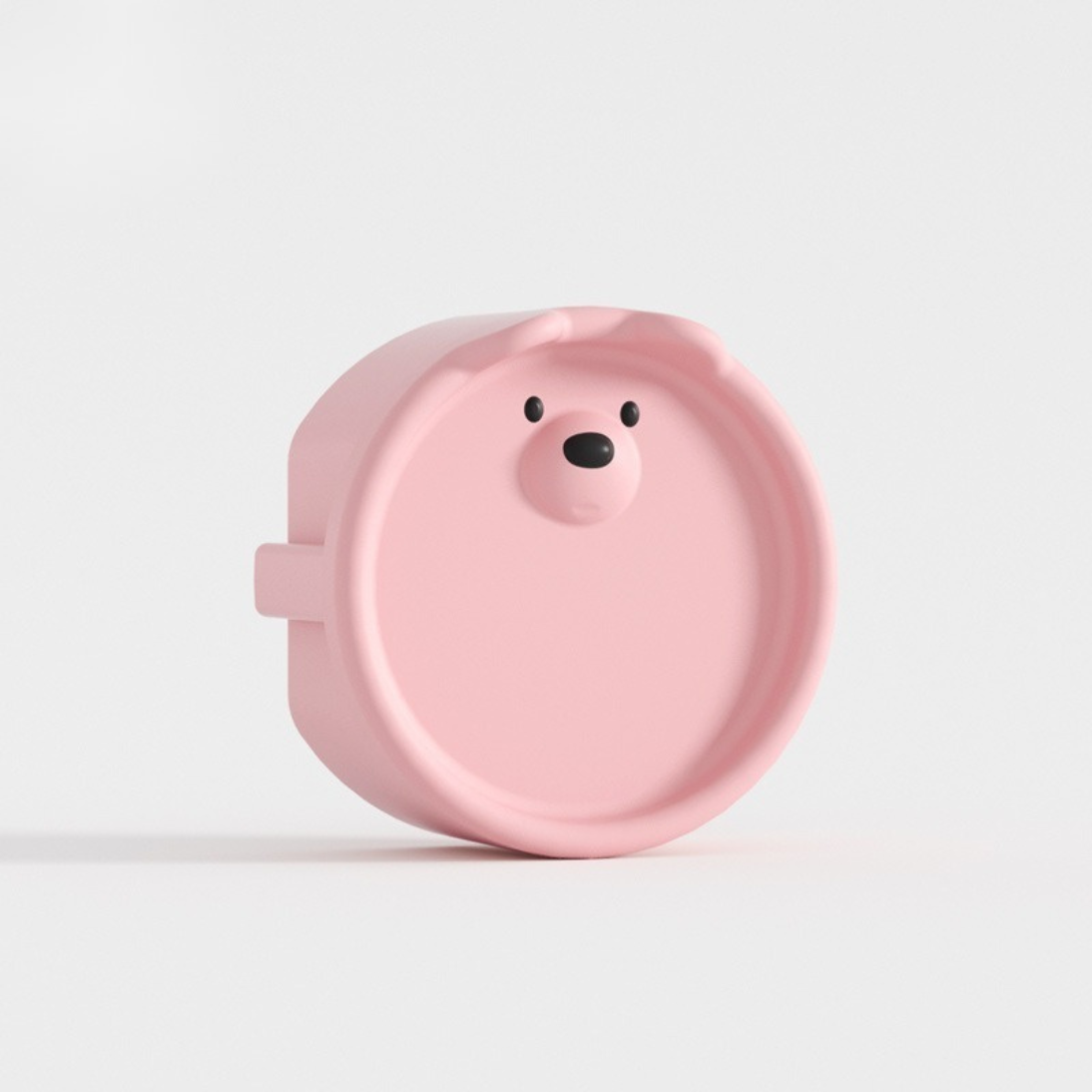 Cache prise bebe ours rose pastel en silicone, protection sécurisée au charme tendre et ludique.