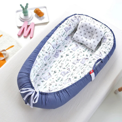 Gros plan sur Cocon pour bébé Ergonomique_-_Selenite_-_lapin