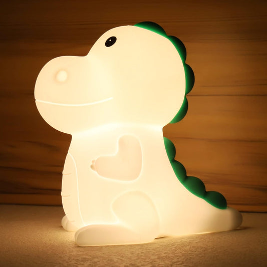Veilleuse Bébé LED Dinosaure Rechargeable Tactile | DreamLight™ diffusant une lumière chaude et douce, design en silicone sûr pour chambre d’enfant.