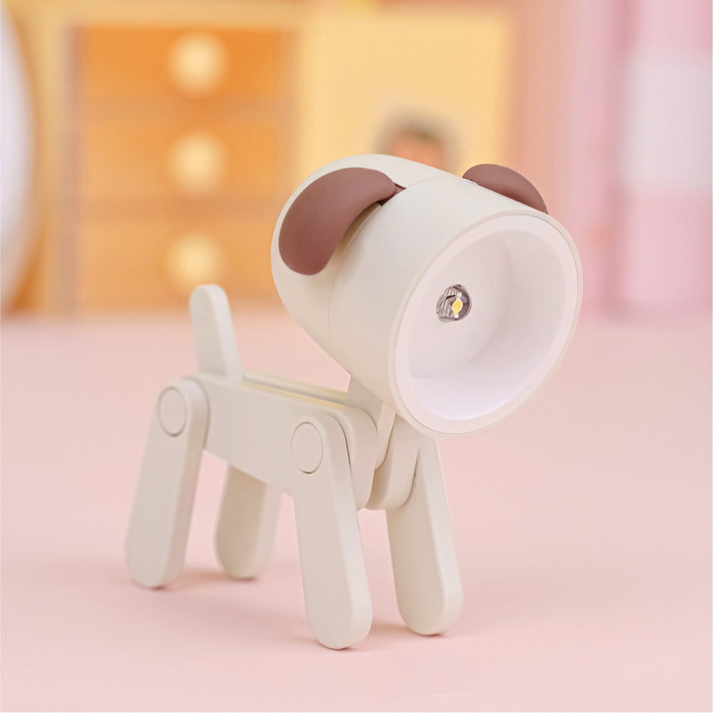 veilleuse bébé chien beige posée sur une table dans une chambre de bébé